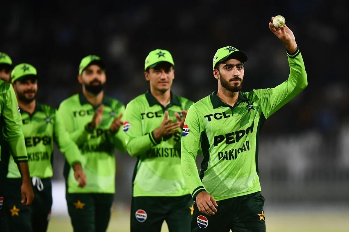 Arafat Minhas walks off after his debut five-wicket haul.