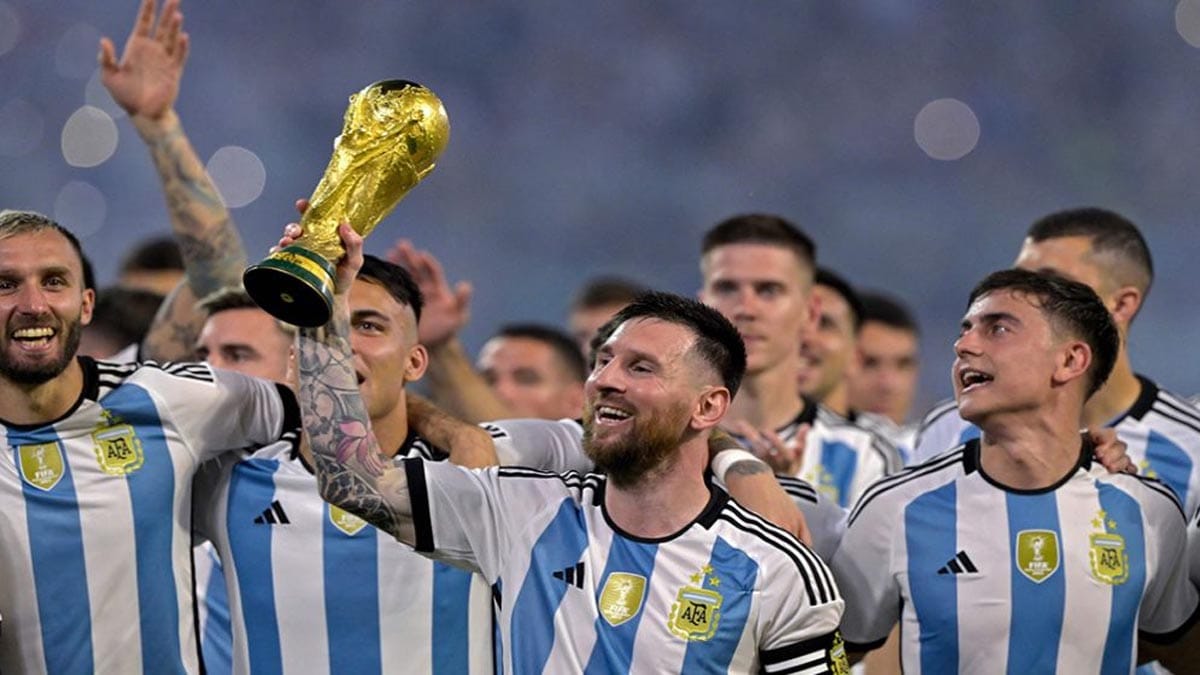 Argentina captain Lionel Messi lifting the trophy with teammates.