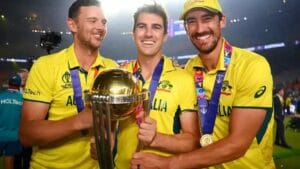 Mitchell Starc, Pat Cummins, and Josh Hazlewood celebrating for Australia.