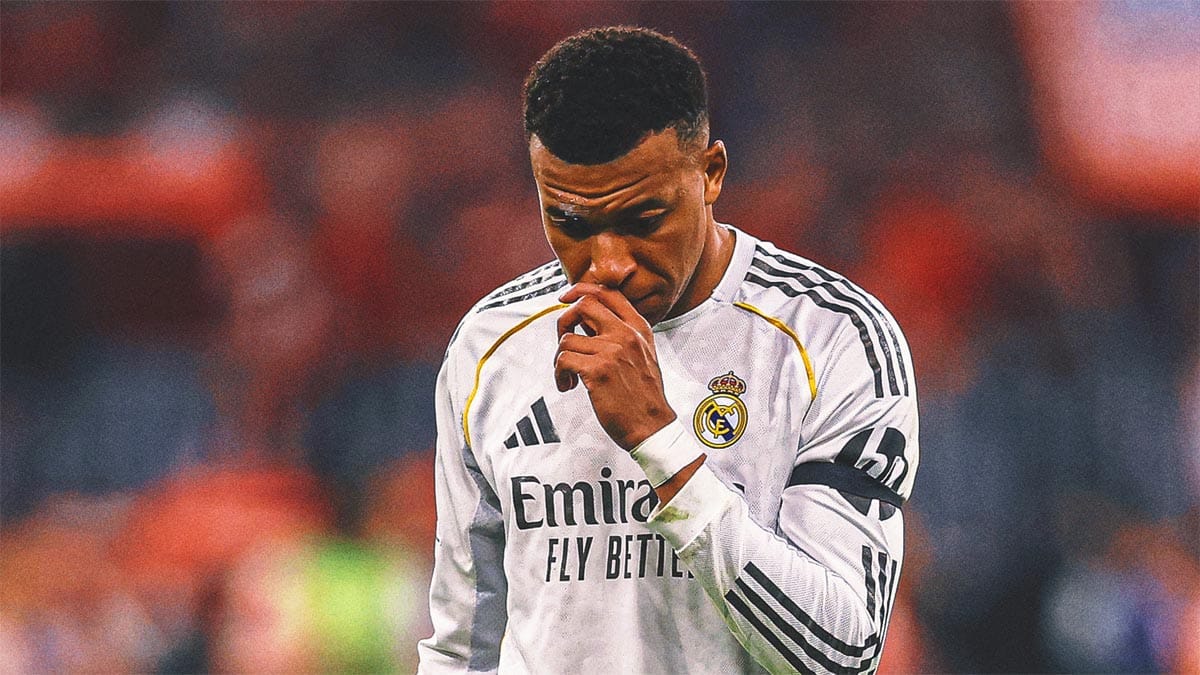 Kylian Mbappe looking disappointed on the pitch at Santiago Bernabeu.