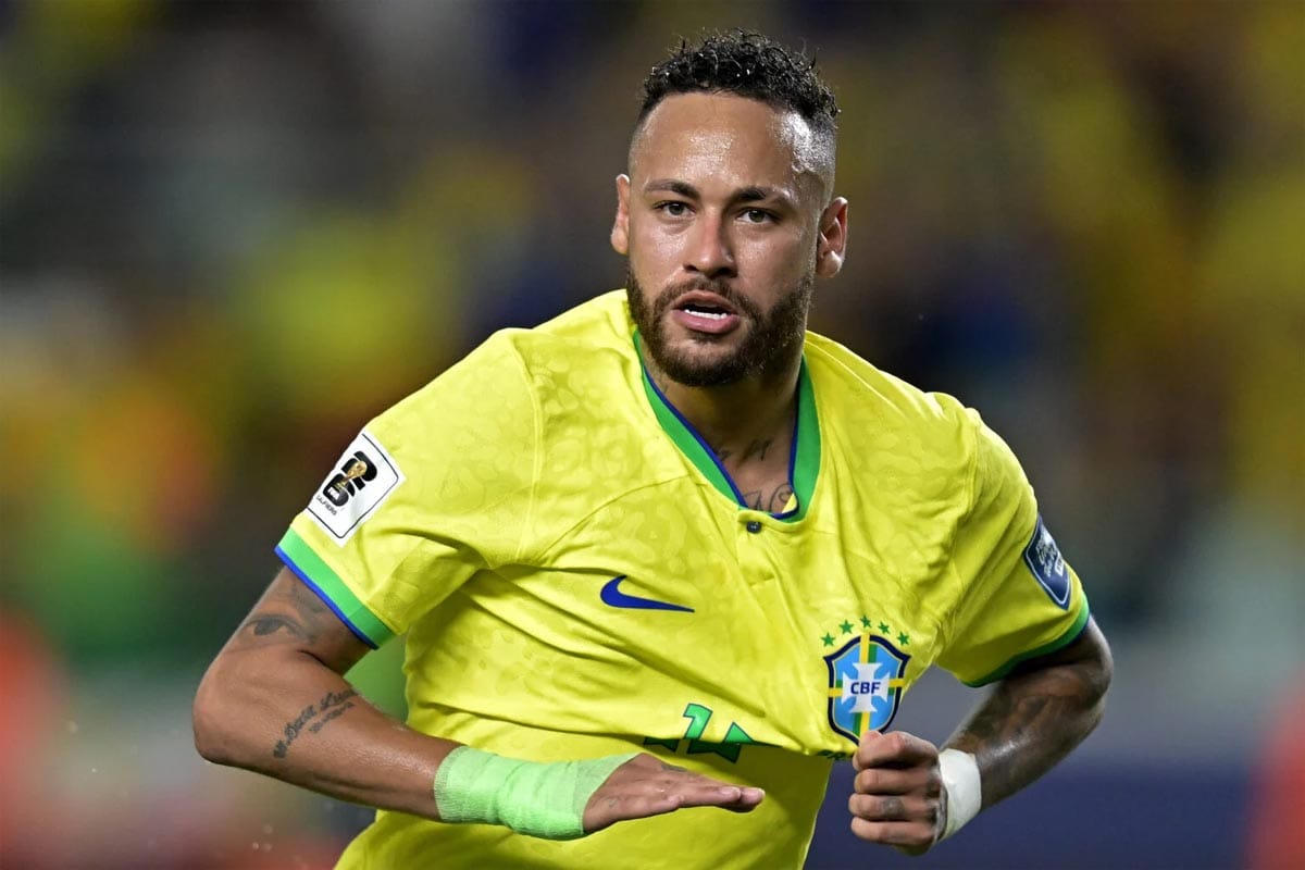 Neymar smiling in Brazil national football team jersey.