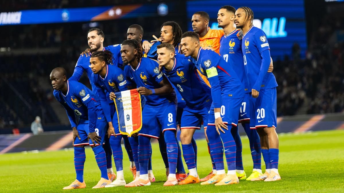 France national football team posing for a group picture in a world cup match.